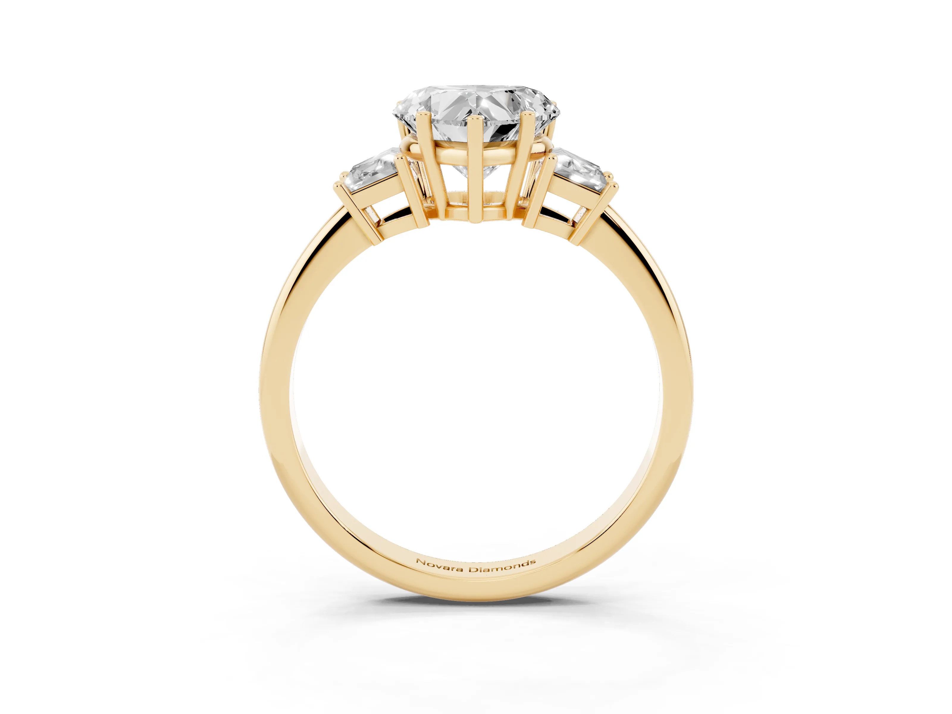 Heart Cut Diamond Three-Stone Ring Set in Yellow gold with Trapezoid Side Stones and Prong Setting