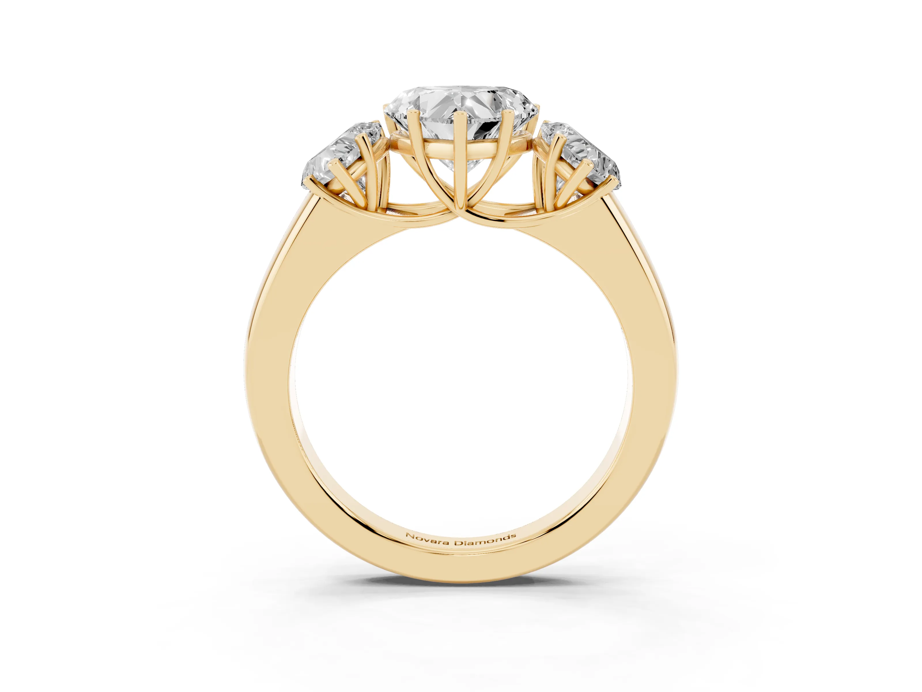 Three-Stone Heart Cut Diamond Ring Set in Yellow gold with Matching Prong Settings and Plain Band