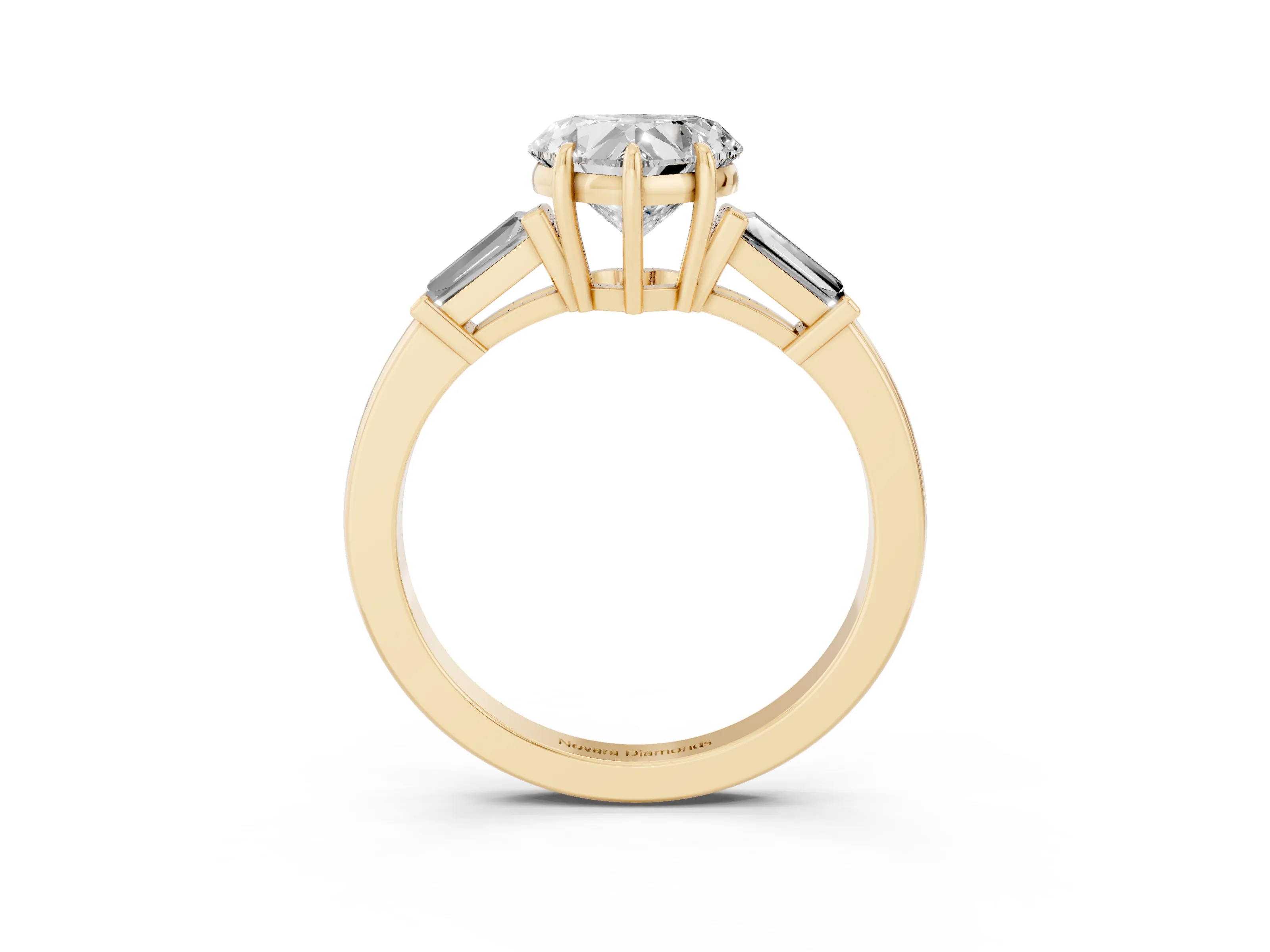 Heart Cut Diamond Three-Stone Ring Set in Yellow gold with Tapered Baguette Side Stones and Prong Setting