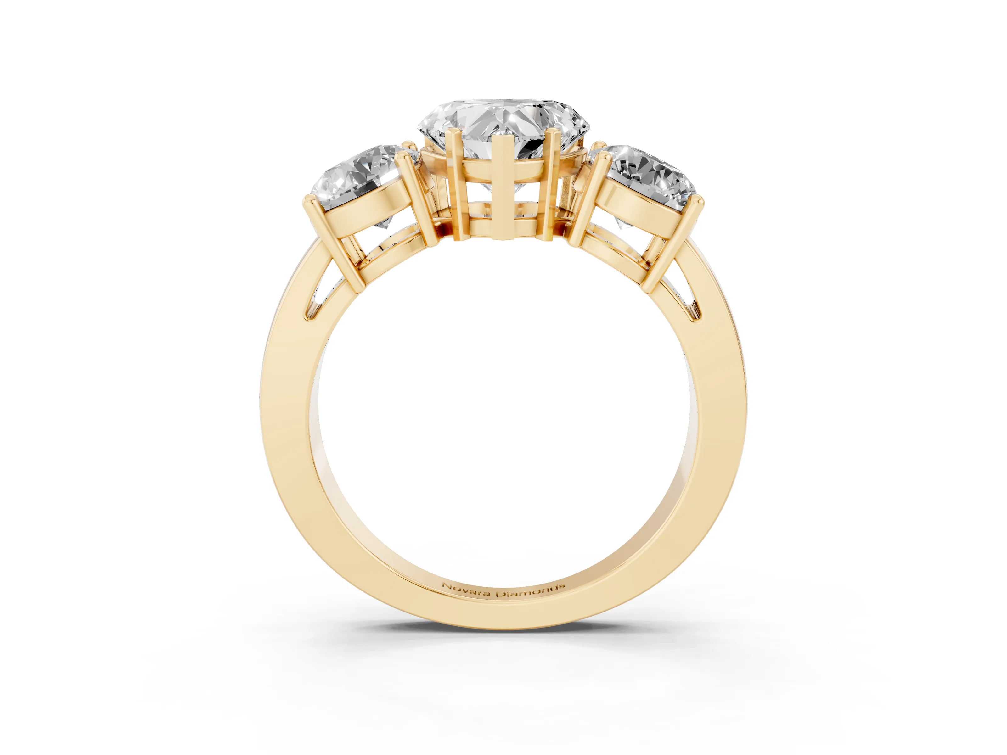 Heart Cut Diamond Three-Stone Ring Set in Yellow gold with Round Side Stones and Classic Band