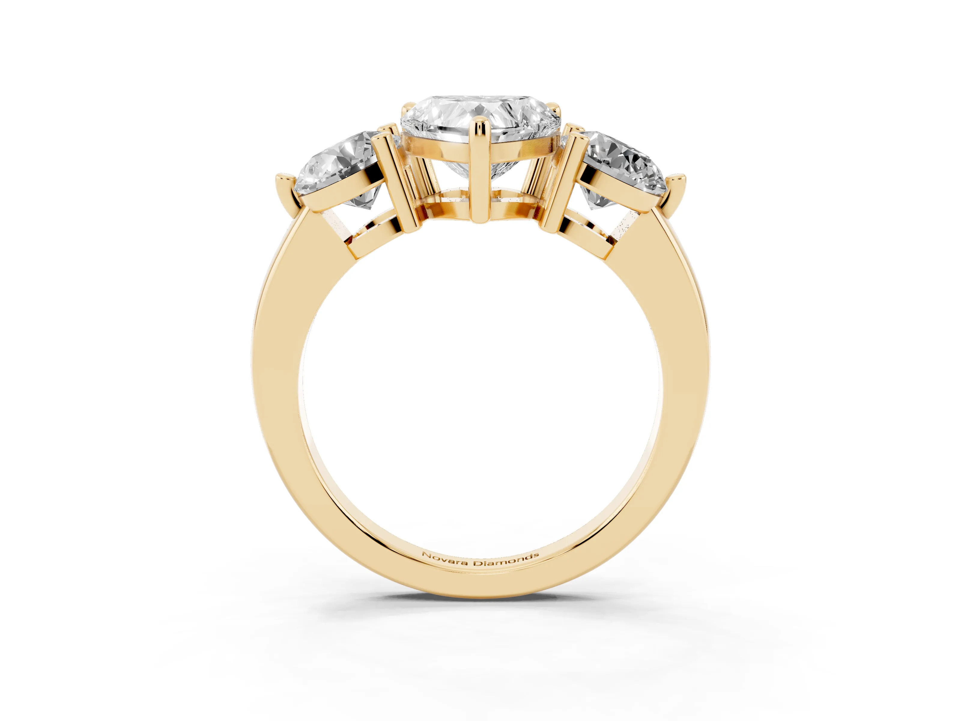 Heart Cut Diamond Three-Stone Ring Set in Yellow gold with Prong Setting and Classic Band