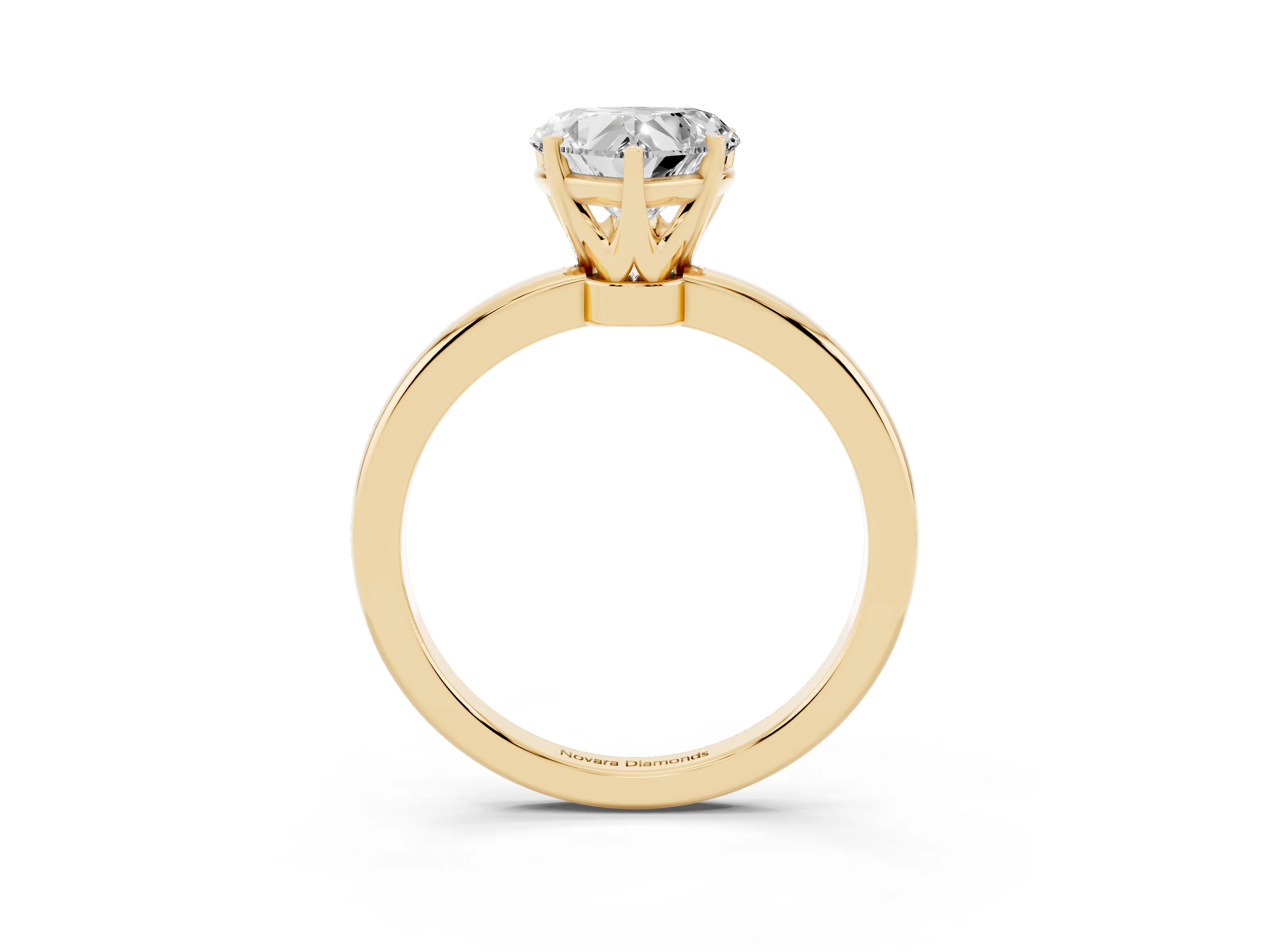 Heart Cut Diamond Solitaire Ring Set in Yellow gold with Raised Prong Setting on a Classic Band