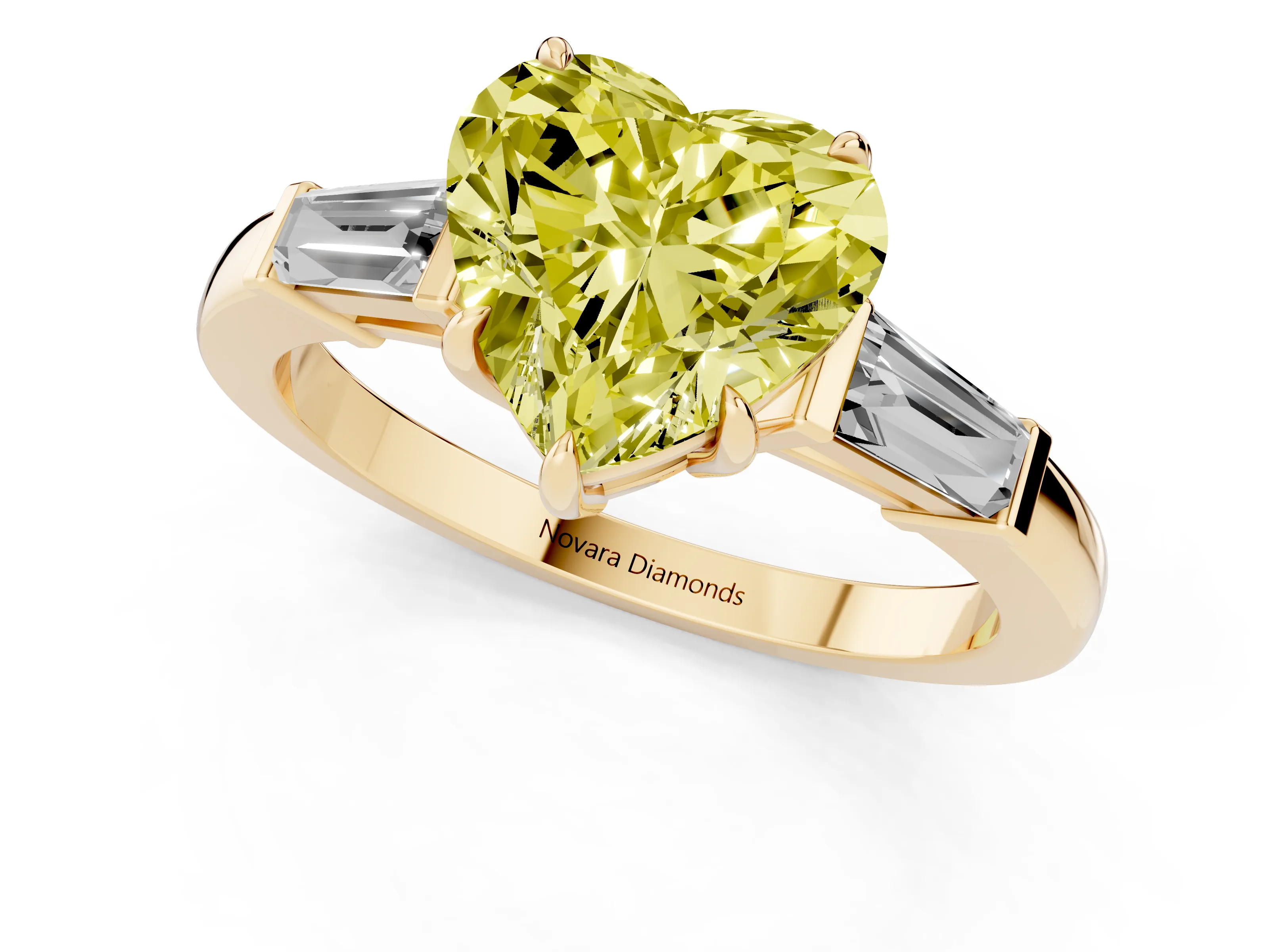 Fancy Yellow Heart Cut Diamond Three-Stone Ring Set in Yellow gold with Tapered Baguette Side Stones and Prong Setting