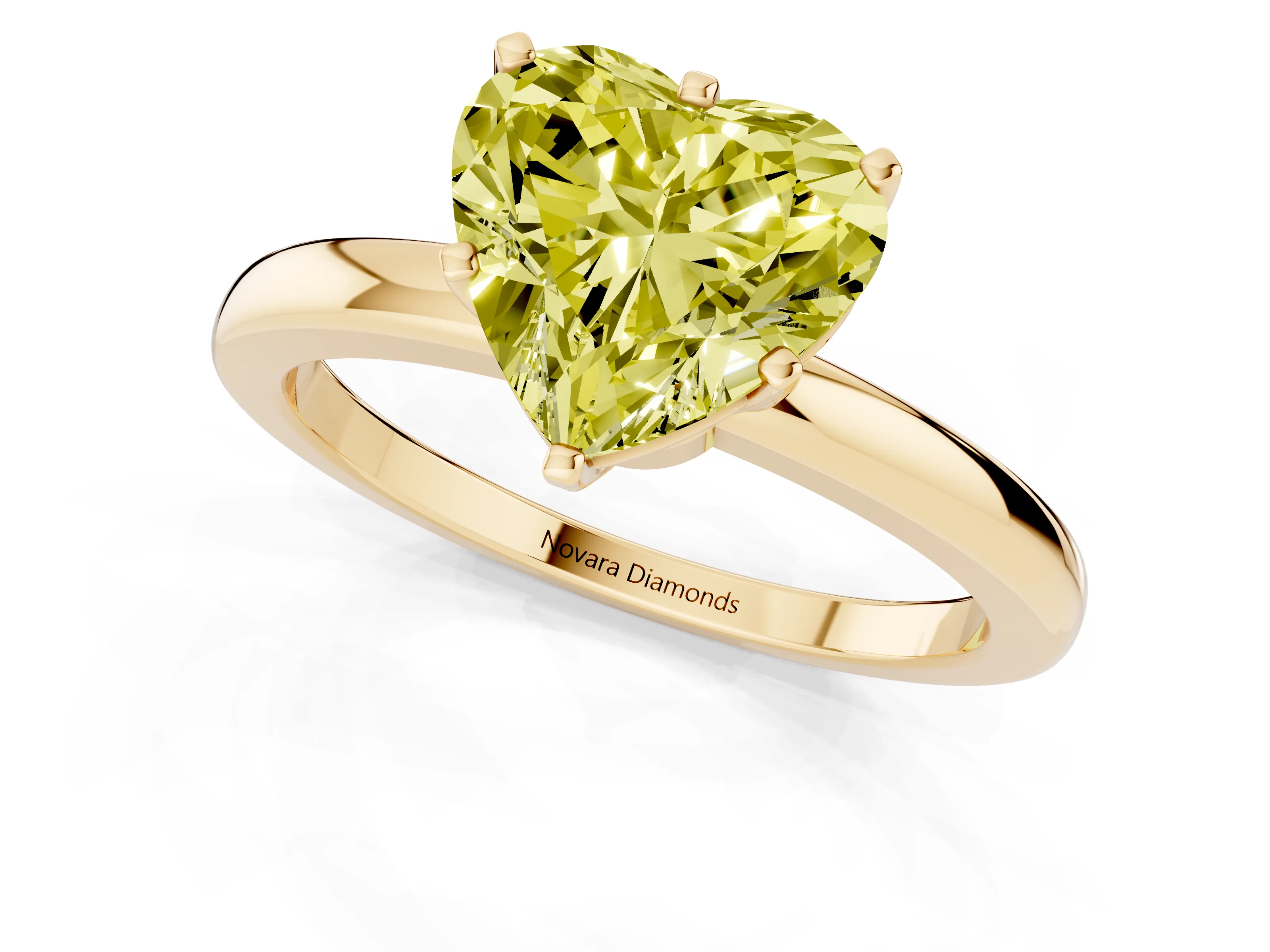 Fancy Yellow Heart Cut Diamond Solitaire Ring Set in Yellow gold with Raised Prong Setting on a Classic Band