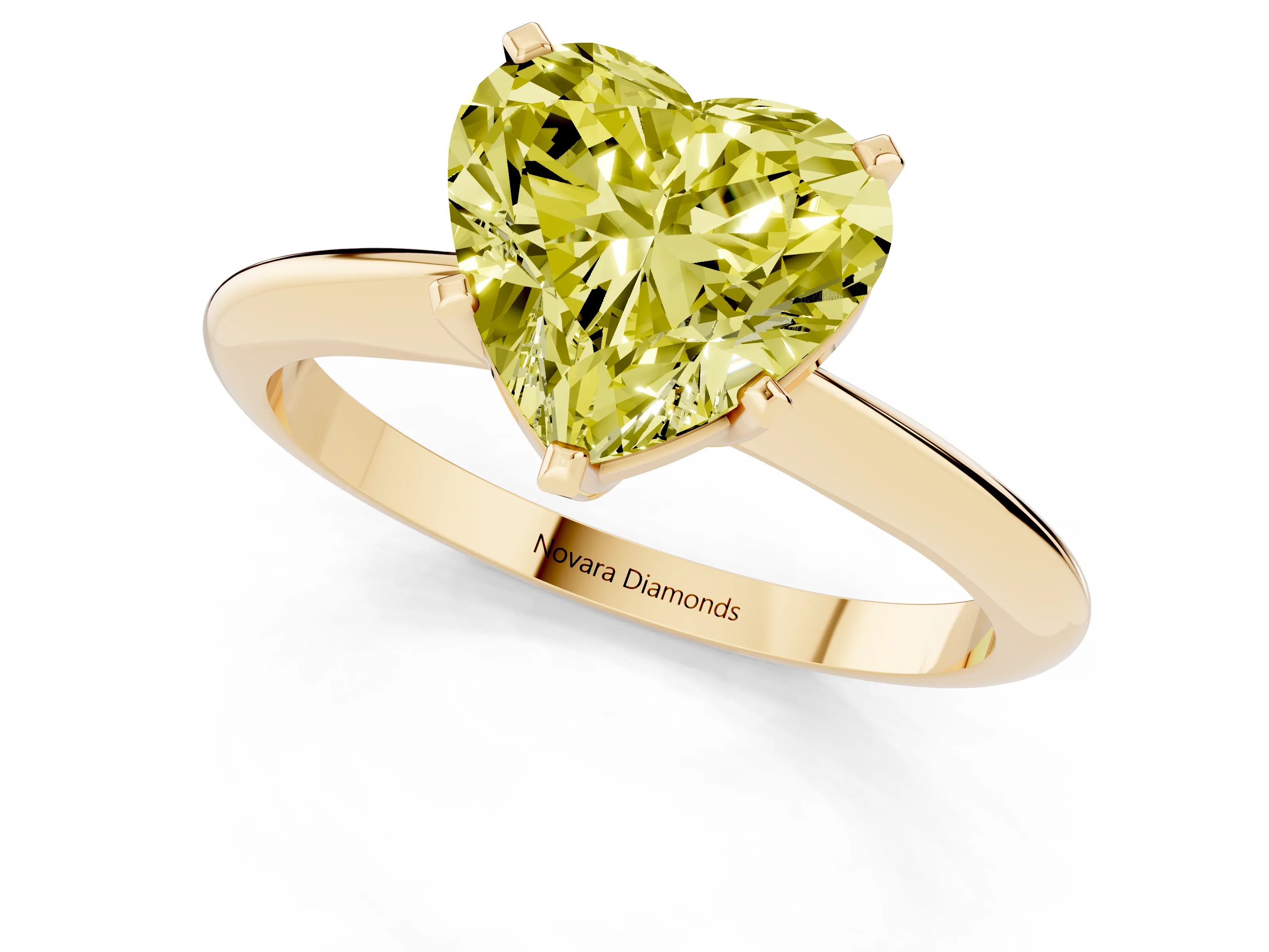 Fancy Yellow Heart Cut Diamond Solitaire Ring Set in Yellow gold with Prong Setting on a Plain Round Band