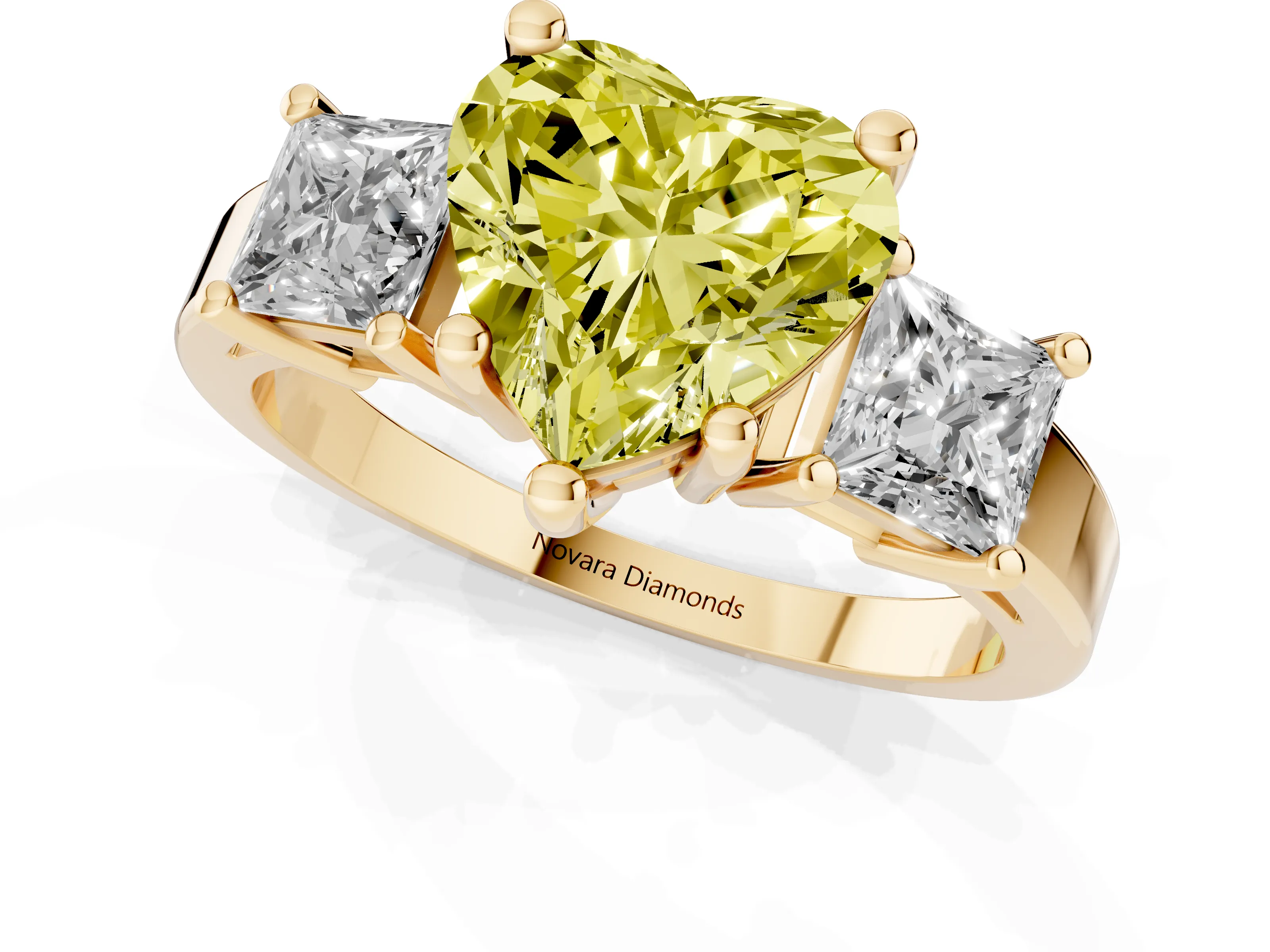 Fancy Yellow Three-Stone Heart Cut Diamond Solitaire Ring Set in Yellow gold with Prong Setting