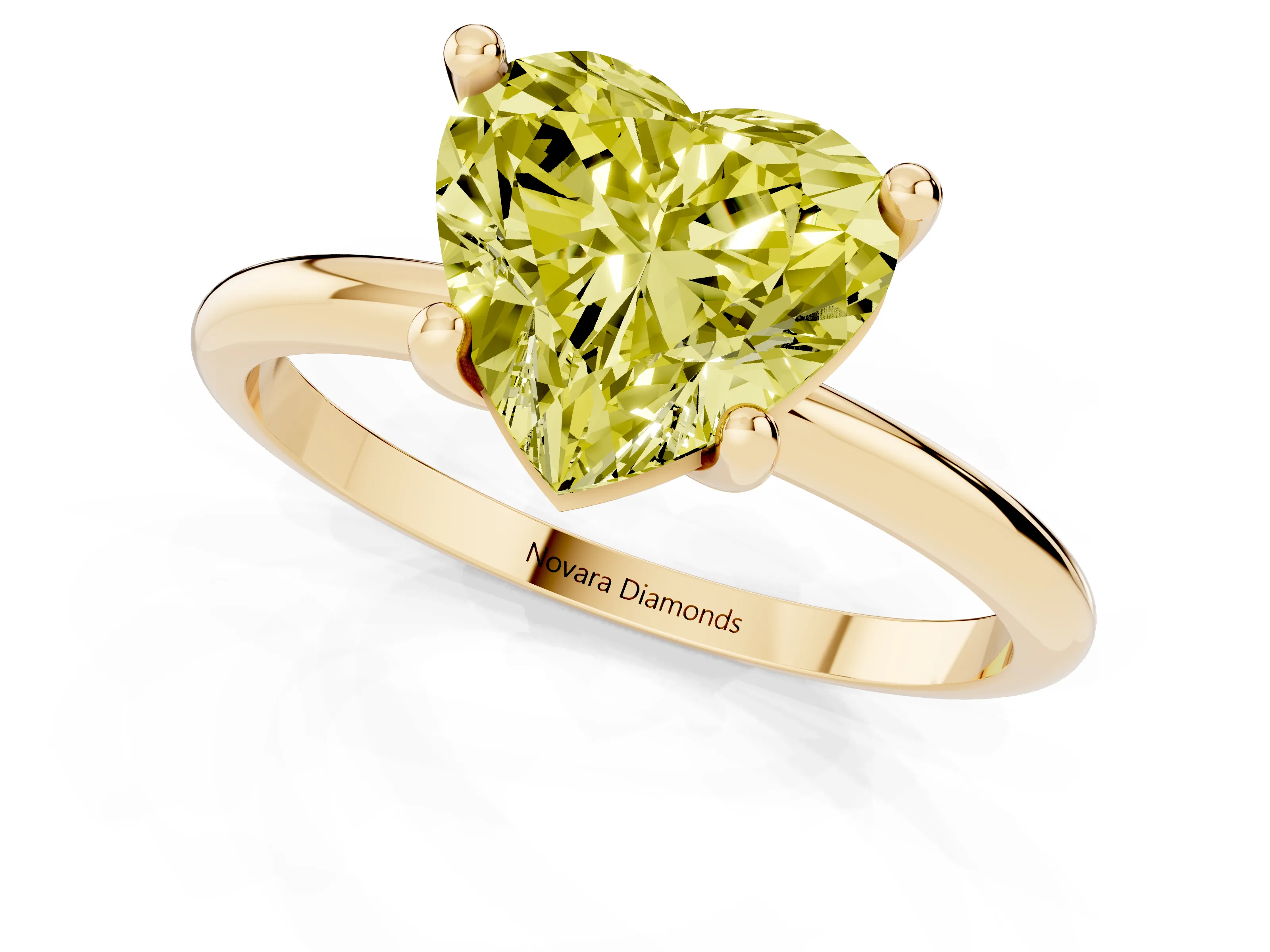 Fancy Yellow Heart Cut Diamond Solitaire Ring Set in Yellow gold with Secure Prong Setting on a Classic Band