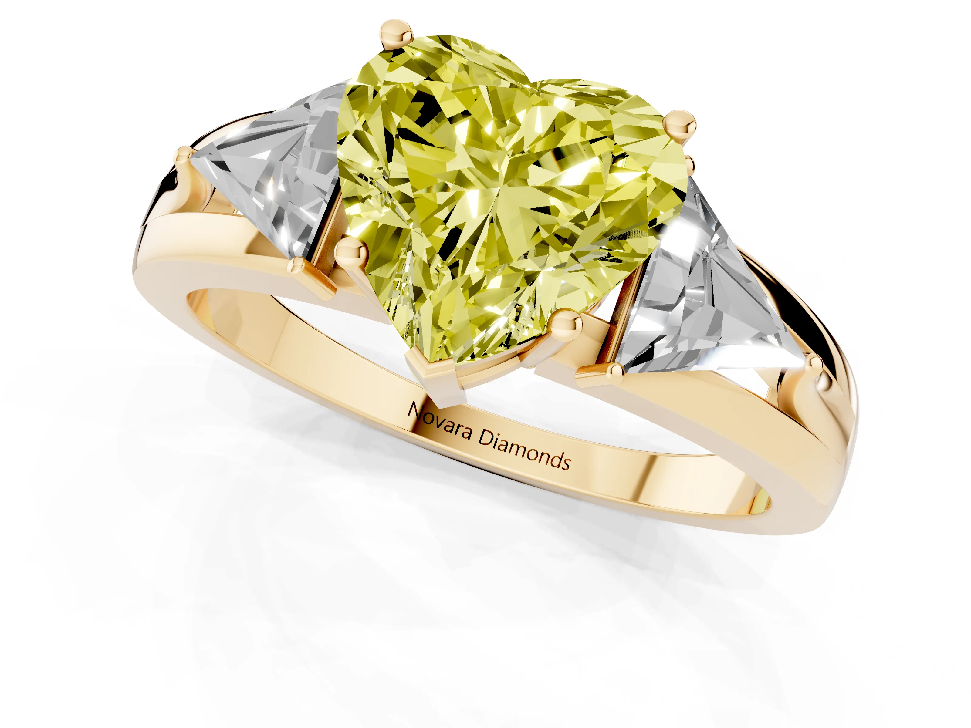 Fancy Yellow Heart Cut Diamond Three-Stone Ring Set in Yellow gold with Trillion Side Stones and Split Shank